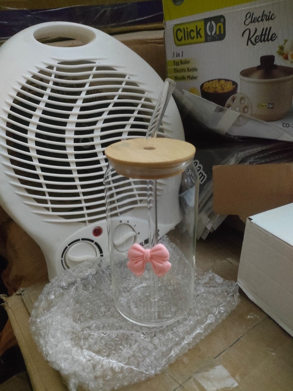 Glass tumbler with bamboo lid packed with protective wrap for shipping